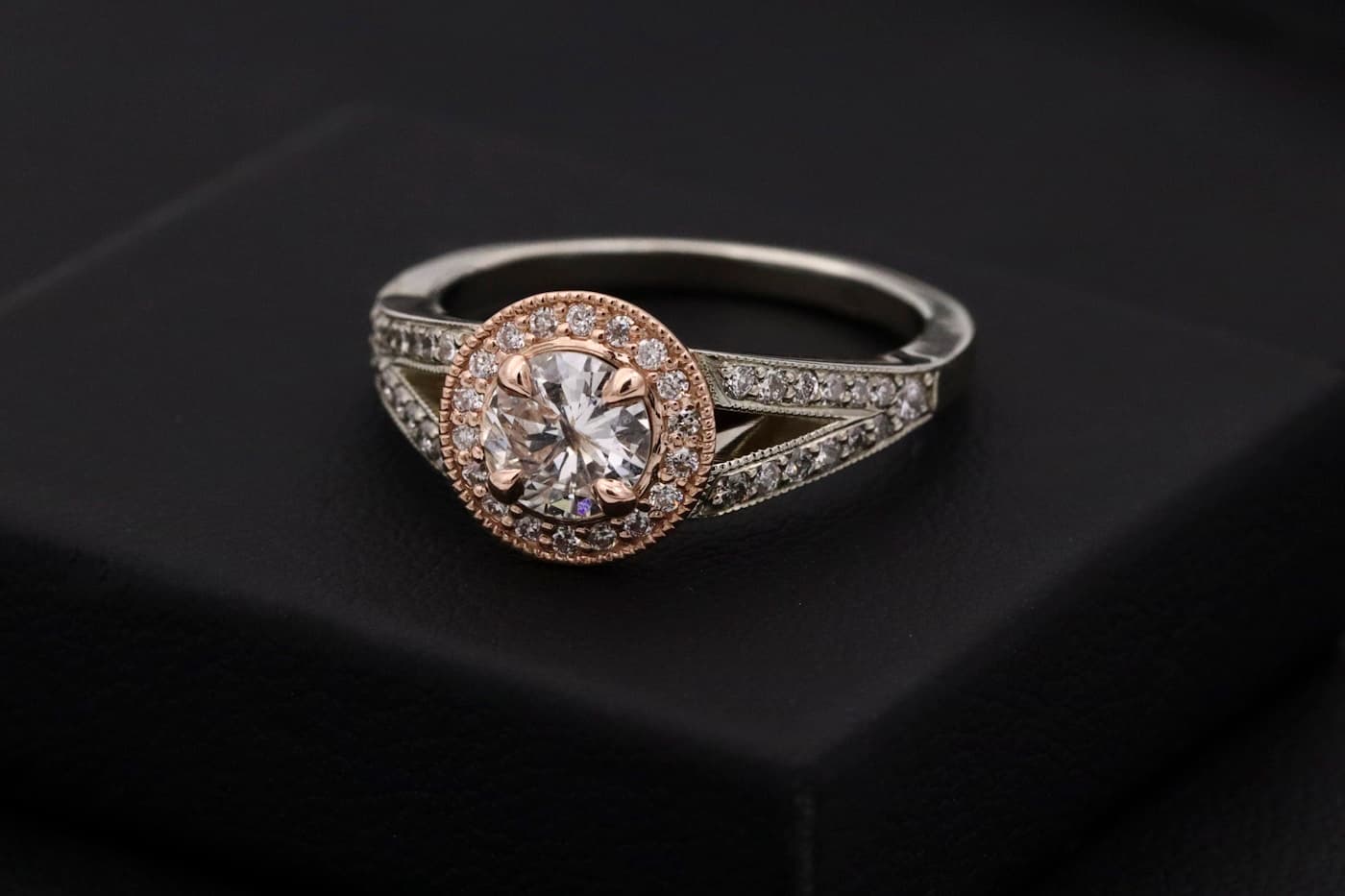 Diamond halo ring on a dark surface